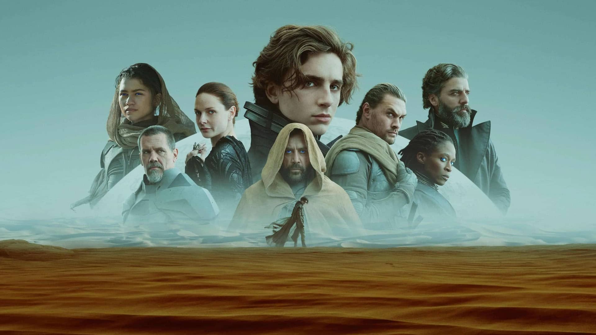 Imagen promocional de la pelicula Dune con todo su reparto sobre la niebla de un desierto