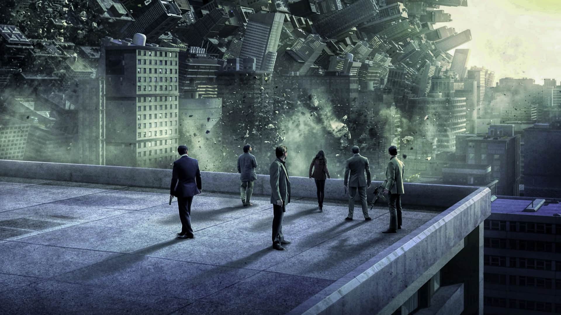 Personajes de Origen en una azotea mirando como los edificios se destrozan